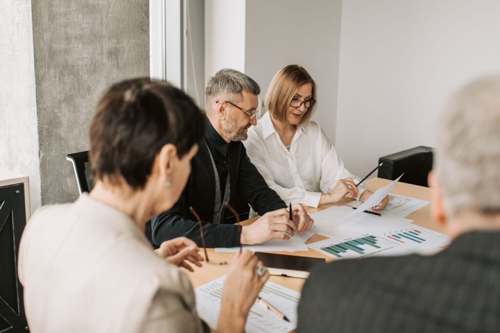 Professionals reviewing financial documents and compliance criteria when evaluating a payroll provider